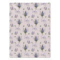 Pale blush blanket with blue and lavender larkspur bouquets, green leaves, and the name Sophia Kate in blue and green lettering.
