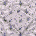 Pale blush swaddle blanket with blue and lavender larkspur bouquets, green leaves, and the name Sophia Kate in blue and green.