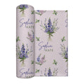 Pale blush swaddle blanket with blue and lavender larkspur bouquets, green leaves, and the name Sophia Kate in blue and green.