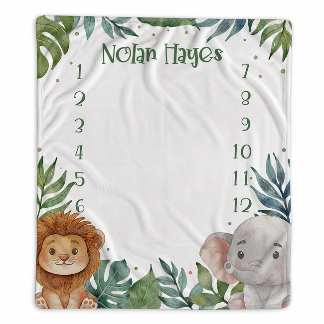 Personalized jungle safari baby milestone blanket with watercolor lion, elephant, tropical leaves, custom name, and months 1–12