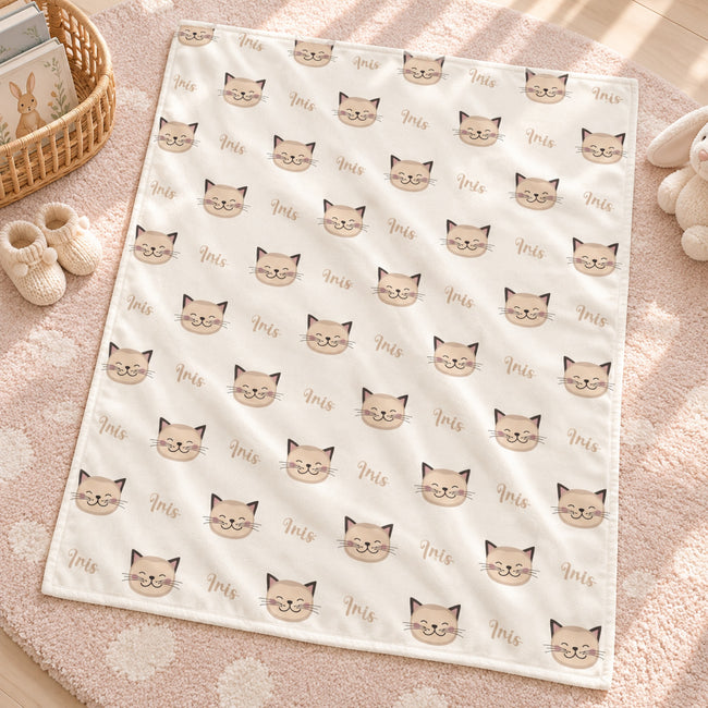 Personalized Kitten Baby Blanket. Sweet kitten faces surround a custom name in a soft, simple design with warm neutral tones.