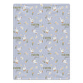 Personalized Goose Baby Girl Blanket. White geese and delicate flowers surround a custom name on a soft lavender background.