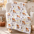 Personalized Halloween Baby Blanket. Playful Halloween characters and cheerful seasonal details surround a custom name in a festive design.