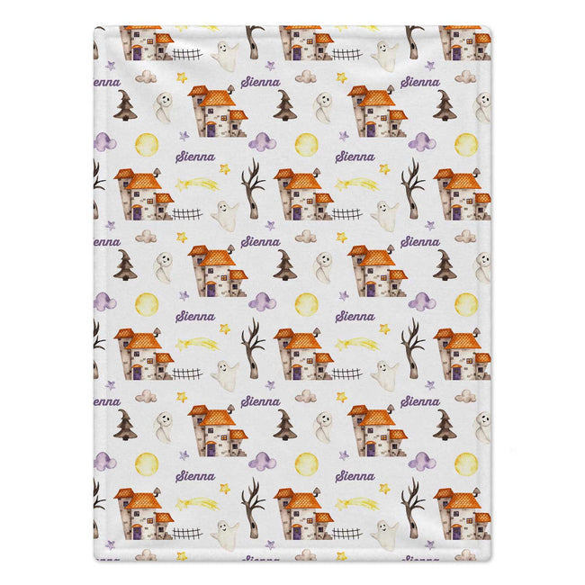 Personalized Halloween Baby Blanket. Playful Halloween characters and cheerful seasonal details surround a custom name in a festive design.