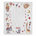 A square white baby growth and milestone blanket featuring circus-themed illustrations, including a bear on a unicycle, a giraffe balancing juggling clubs, an elephant, a cat, and a dog, with red numbers marking 1 through 12 months.