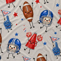 A close-up of a white fabric with a playful, cartoonish sports pattern featuring footballs, helmets, a megaphone, foam fingers, and stars in red, blue, and brown.