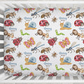 A crib bedding set featuring a white fitted sheet printed with a colorful pattern of cartoon ladybugs, butterflies, ants, caterpillars, and a snail, each accompanied by the text 'Daisy MAE'.