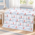 Personalized Lighthouse Baby Blanket. Red-and-white lighthouses, little seabirds, and blue watercolor waves create a coastal setting for a custom name.