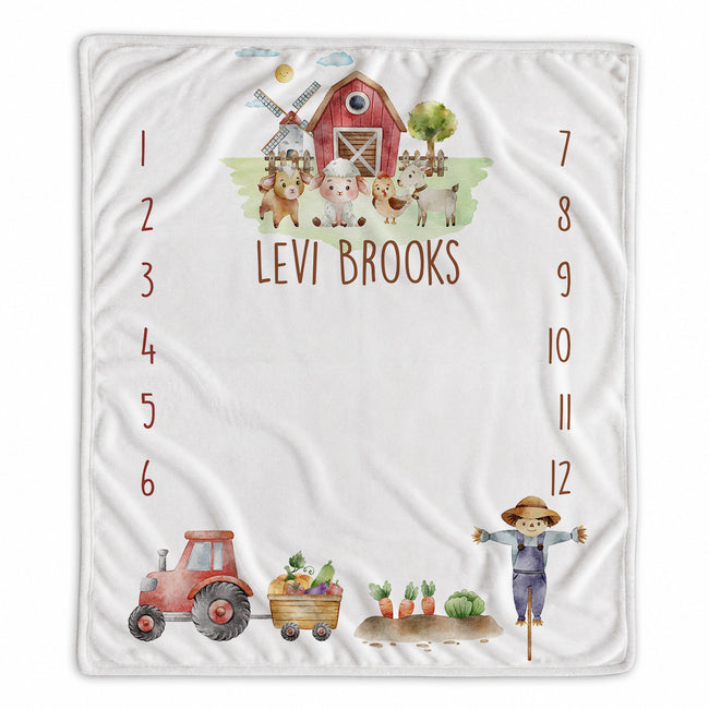Personalized Little Red Barn baby milestone blanket with farm animals, tractor, scarecrow, custom name, and months 1–12