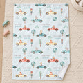 Personalized Animal Race Car Baby Blanket. Friendly animals drive colorful race cars among trees, clouds, and traffic lights around a custom name.
