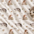 Personalized Woodland Animal Baby Blanket. Sweet hedgehogs, raccoons, snails, and meadow plants surround a custom name on a soft neutral background.
