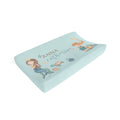 A contoured baby changing pad cover in light blue, personalized with the name 'ANNA catherine' and decorated with cute mermaid and sea turtle illustrations, shown on a plain white background.