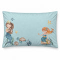 A rectangular light blue pillow featuring a whimsical mermaid illustration with two mermaids, a turtle, fish, and starfish in soft pastel colors.