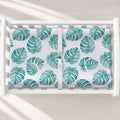 Monstera Leaves Changing Pad Cover, featuring lush tropical greenery for a fresh, modern touch in a botanical or nature-inspired nursery.