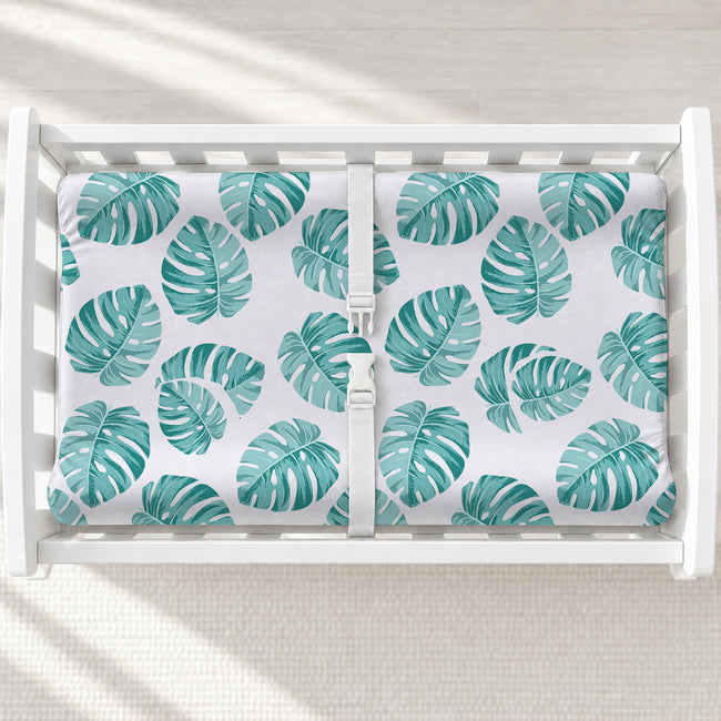 Monstera Leaves Changing Pad Cover, featuring lush tropical greenery for a fresh, modern touch in a botanical or nature-inspired nursery.