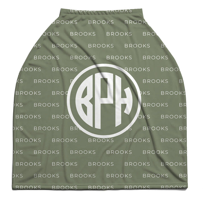 A sage baby car seat cover with a white monogram logo reading 'BPH' inside a circle, set against a repeating white 'BROOKS' background pattern.
