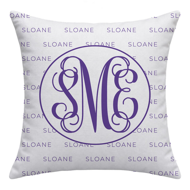 A square white throw pillow featuring a purple monogram design with the letters 'S', 'M', and 'E' inside a circle, surrounded by a repeating purple 'SLOANE' background pattern.