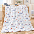 Personalized Nautical Stripe Baby Boy Blanket. Sailboats, lighthouses, starfish, and seahorses surround a custom name over soft blue stripes.