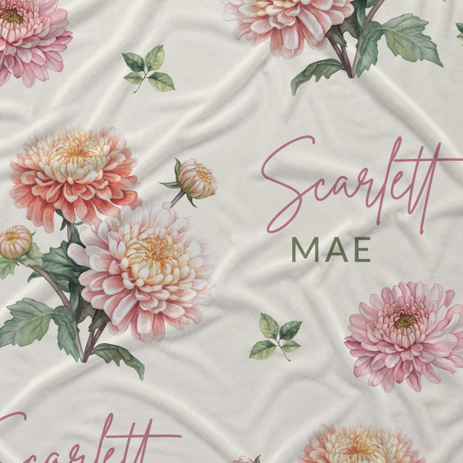 Ivory fabric with peach and pink chrysanthemums, green foliage, and the name Scarlett Mae in rose script and green lettering.