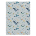 Personalized Sea Animal Baby Blanket. Whales, dolphins, turtles, narwhals, and other ocean friends surround a custom name on a soft blue-grey background.