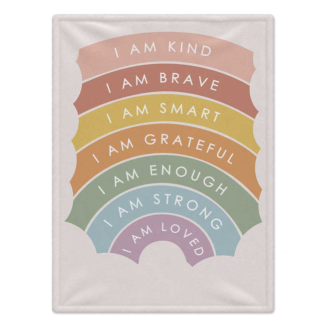 A personalizedwith a pastel rainbow design featuring positive self-affirmations like 'I AM KIND', 'I AM BRAVE', and 'I AM LOVED' in white text.