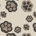 A repeating pattern of stylized paw prints in dark charcoal gray and taupe on a warm beige background.