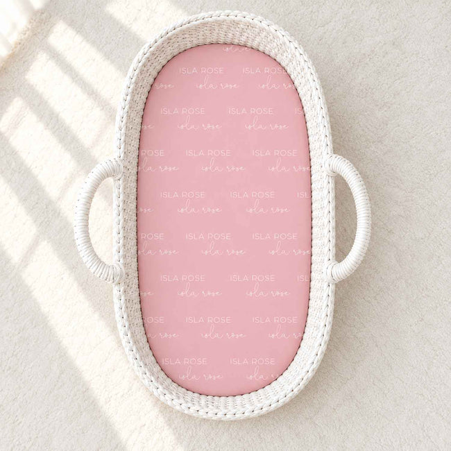 A baby bassinet with a personalized sheet