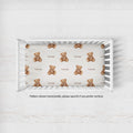 Teddy bear crib sheet personalized with Rowan in a white crib; note states the pattern is horizontal, with vertical available by request.