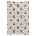 Full view of a personalized teddy bear swaddle blanket with repeating watercolor bears and the name Rowan on a white background.