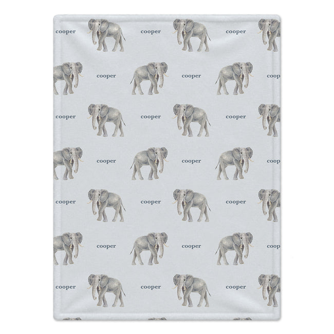Full view of Little Elephant personalized baby blanket with gray watercolor elephants and the name Cooper on a pale blue background.