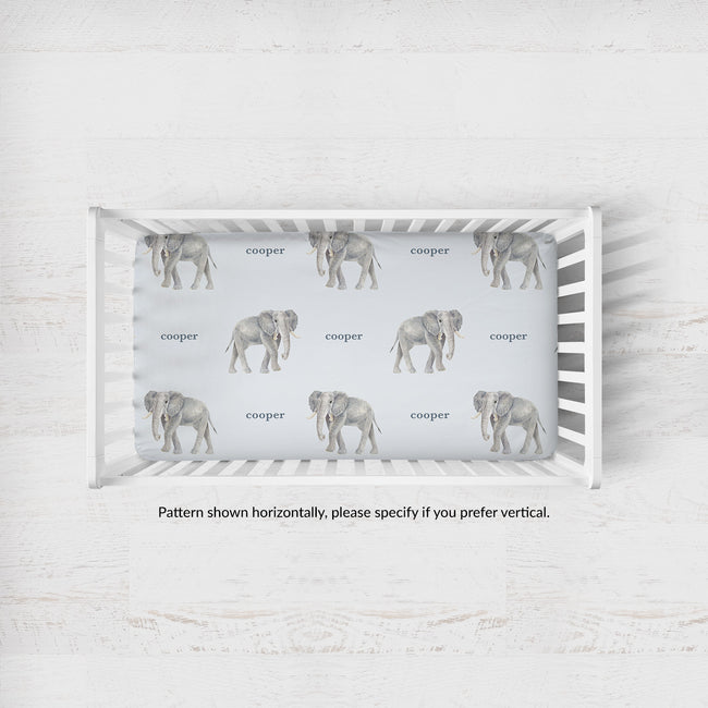 Little Elephant crib sheet personalized with Cooper in a white crib; caption notes horizontal pattern placement, with vertical available by request.