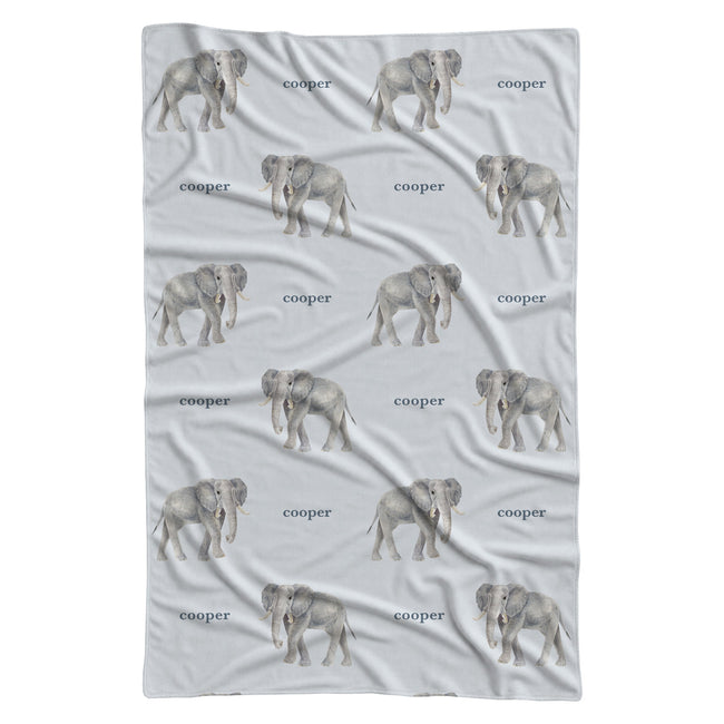 Full view of Little Elephant personalized swaddle blanket with repeating gray watercolor elephants and the name Cooper on pale blue.