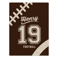 Brown personalized football blanket with cream laces, the name Henry, number 19, and FOOTBALL lettering.