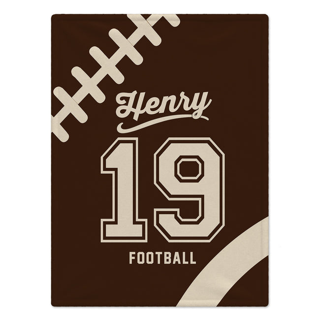 Brown personalized football blanket with cream laces, the name Henry, number 19, and FOOTBALL lettering.