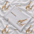 Folded Little Giraffe personalized swaddle blanket showing watercolor giraffe pairs and the name Emerson in brown on white.