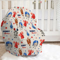 A baby car seat cover featuring a personalized football-themed print with cartoon players, referees, stars, and the name 'HENRY Thomas' on a cream background, styled in a nursery setting.