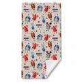 A personalized beach towel with a custom name 'HENRY Thomas' printed in a repeating pattern of football-themed cartoon characters on a beige background.