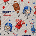 Personalized fabric featuring a cute football-themed pattern with cartoon characters and the name 'HENRY thomas'.