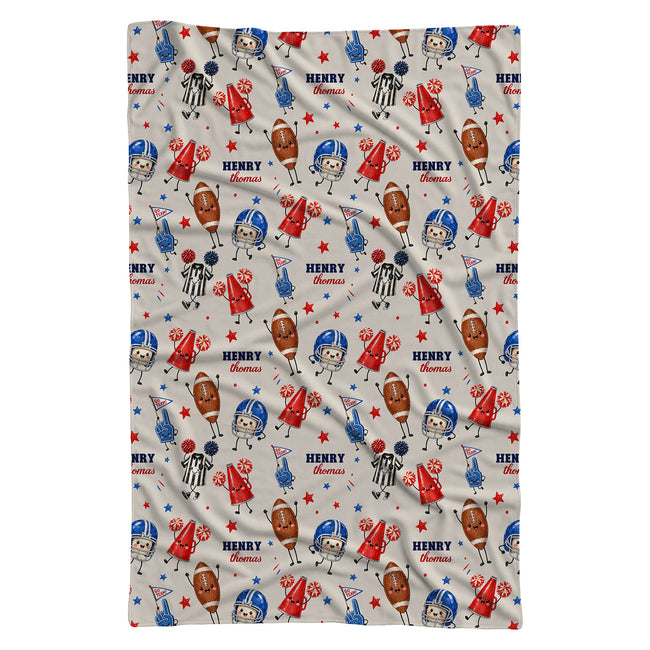 A baby swaddle blanket featuring a repeating cartoon pattern of football players, referees, footballs, stars, and the text 'HENRY the dumbass' on a light beige background.