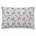 Monster Trucks pillowcase personalized with brown Ryder lettering, featuring colorful watercolor trucks and orange flames on a pale blue background.