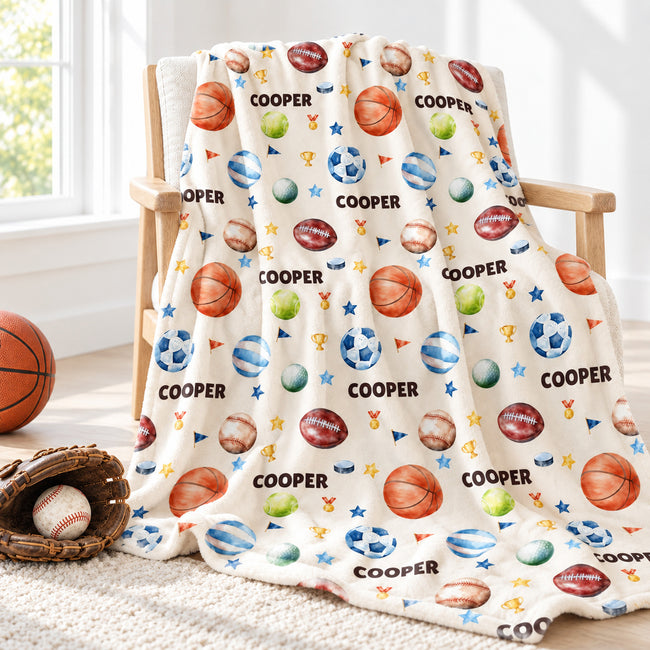 Personalized sports blanket featuring basketball, baseball, soccer, golf, volleyball, football, tennis and with name Cooper on it