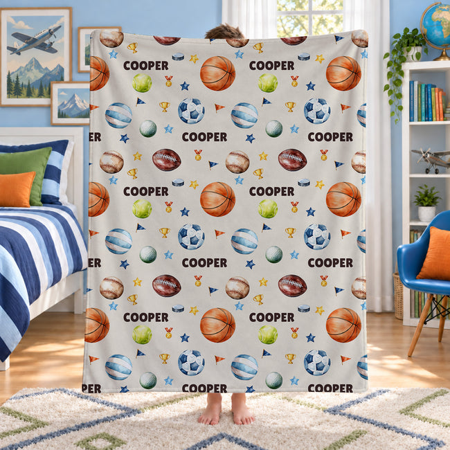 Personalized sports blanket featuring basketball, baseball, soccer, golf, volleyball, football, tennis and with name Cooper on it