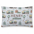 A personalized rectangular pillow featuring a watercolor-style train pattern on a light gray background, with the custom text 'HENRY william' printed in the center.
