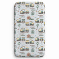 A personalized fitted sheet with a repeating pattern of vintage yellow trains, a small red barn, trees, and the names 'HENRY' and 'william' on a light gray background.