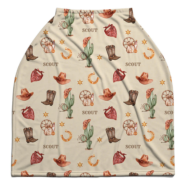 Wild West car seat cover personalized with Scout, featuring watercolor cowboy boots, hats, cacti and red bandanas on cream.