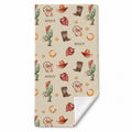 Wild West beach towel personalized with Scout, featuring cowboy motifs on cream and a turned corner showing the white reverse.