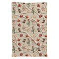 Full view of a Wild West swaddle blanket with Scout repeated among watercolor cowboy boots, hats, cacti and bandanas.
