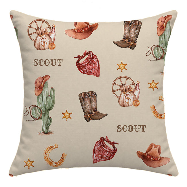 Square Wild West throw pillow personalized with Scout, featuring watercolor cowboy boots, hats, cacti and red bandanas on cream.