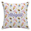 A square decorative throw pillow with a white background and a colorful watercolor ice cream cone pattern, featuring the personalized name 'Abigail' in purple script across the center.