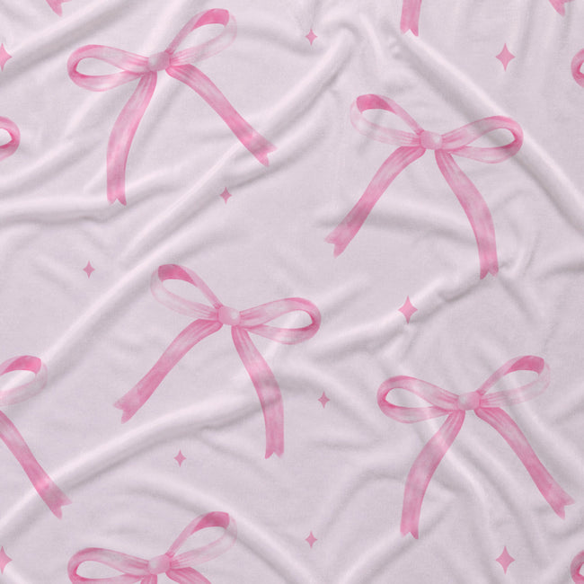 Blush pink fabric with watercolor bows, tiny sparkles.
